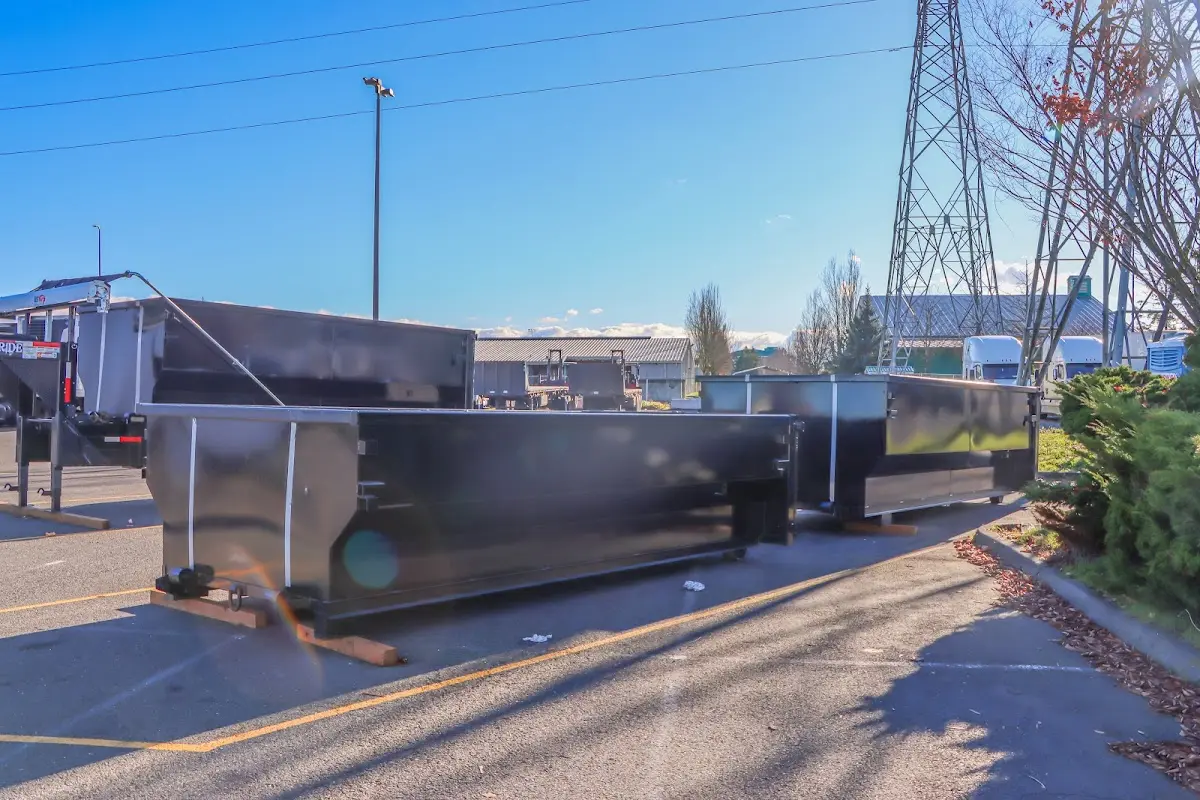 Roll-off dumpster ready for waste disposal at job site for Demolition Dumpster Rental in Surf City